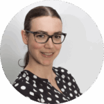 Los Angeles wedding officiant Rev. Mercy Ibarra smiling at the camera wearing a black & white polka dot blouse.